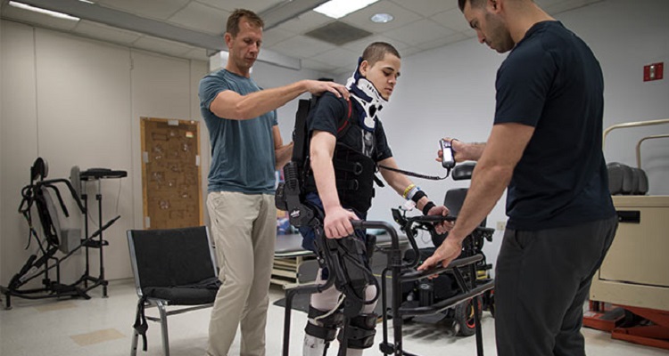 team and patient in rehab